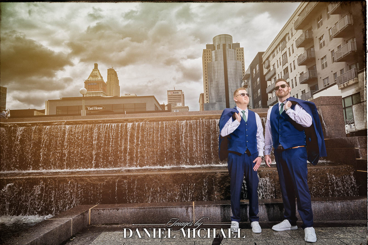 Brandon and Scott in front of fountain waterfall